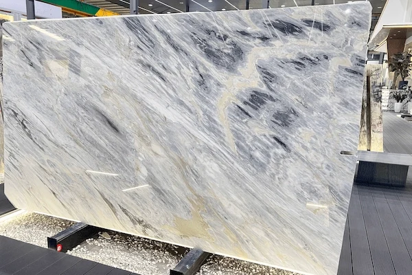 Manhattan Marble slab surface inspection showing elongated grey-black mineral movement