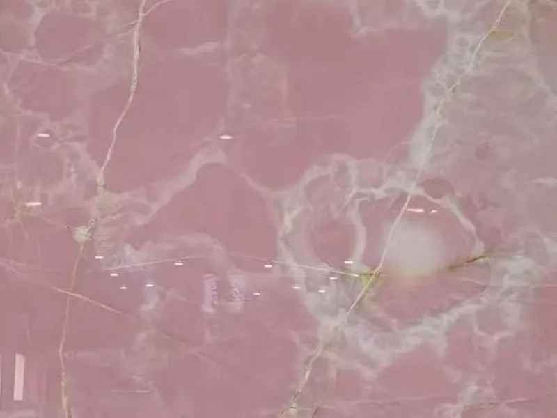 Pink onyx polished slab showing warm rose-pink translucency and natural banding patterns - premium calcareous onyx selected for backlit feature walls