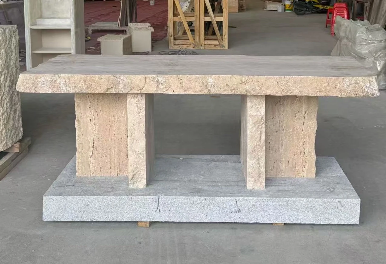 Travertine rectangular table top assembled on block supports during furniture quality review