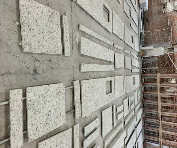 Santa Cecilia White Granite tiles arranged for dry-lay review in a supplied factory image