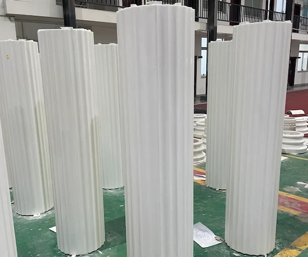 Tall fluted Sivec White Marble shaft components positioned upright for factory review