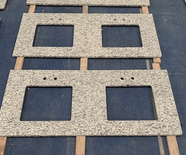 Tiger Skin White Granite Vanity Top cut-out vanity top components arranged in a supplied factory fabrication reference