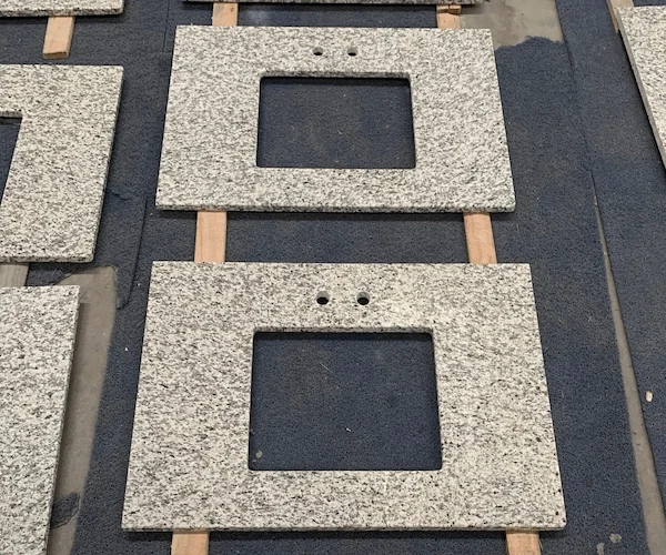 Tiger Skin White Granite Vanity Top vanity top components shown in a supplied factory dry-lay or assembly reference image