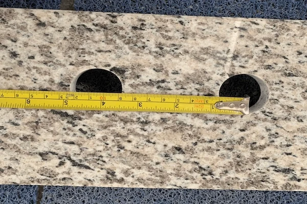 Tiger Skin White Granite Vanity Top cut-out and faucet-opening detail shown in a supplied production reference image