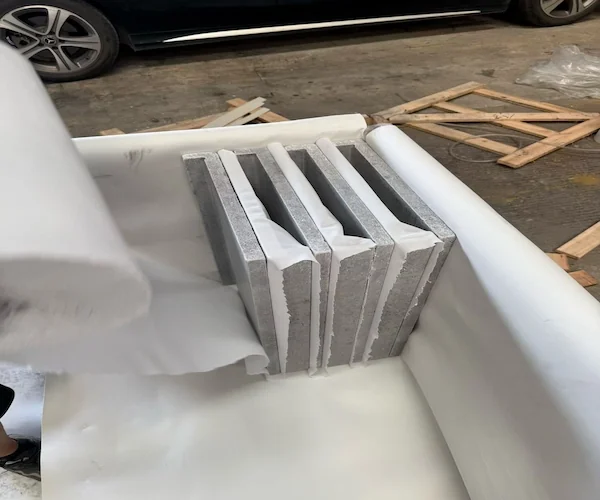 Tumbled Grey Limestone Pool Coping bundled coping pieces shown in a supplied storage reference