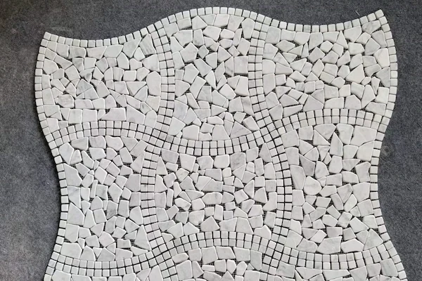 Tumbled Light Marble Mosaic stone pieces shown in a supplied mesh-mounted module review image