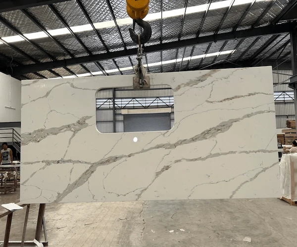 White Calacatta Quartz Kitchen Top cut-to-size kitchen top components sequenced on a factory floor in a supplied fabrication reference