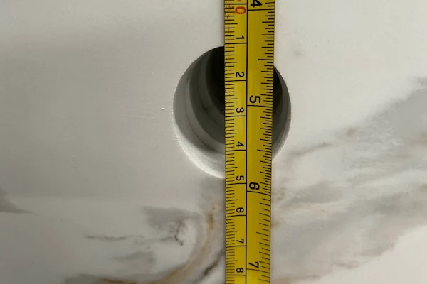 White Calacatta Quartz Vanity Top fabricated vanity component shown for cut-out and surface-detail review in a supplied factory image