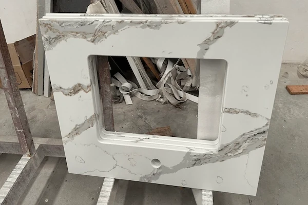 White Calacatta Quartz Vanity Top cut-out and faucet-opening detail shown in a supplied production reference image