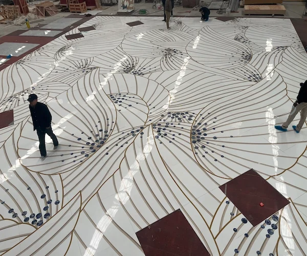 White Marble Waterjet Inlay with Blue Accents shown in a supplied joint review reference image