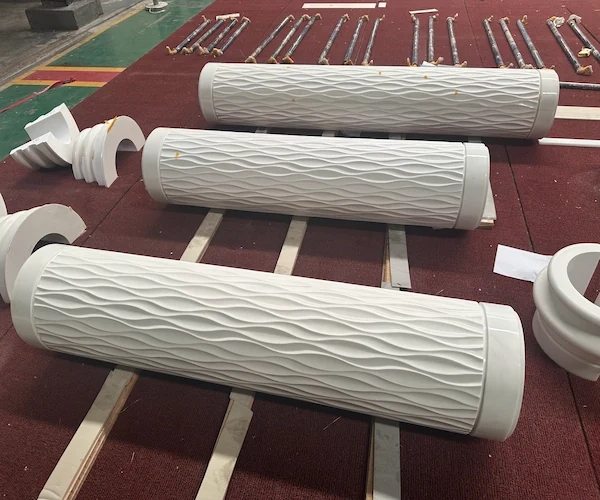 White Marble fluted shafts and base components dry-laid on a factory floor