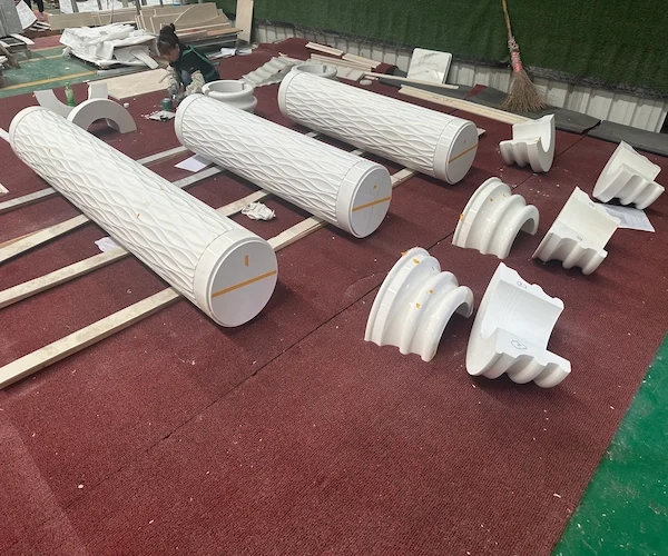 White Marble fluted column shafts with capitals and bases aligned in a factory layout