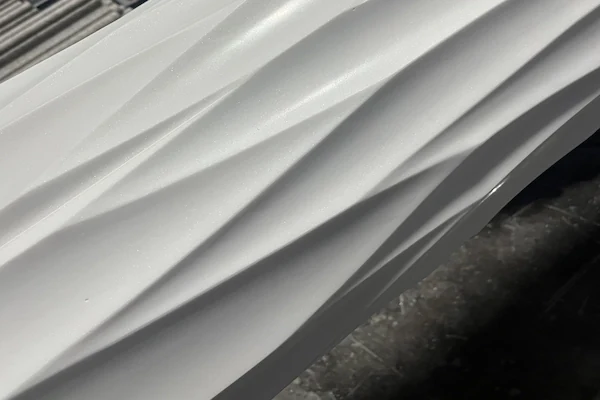White Marble fluted shaft surface shown in a close workshop production view