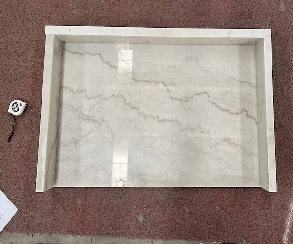 White Marble Vanity Top cut-out vanity top components arranged in a supplied factory fabrication reference
