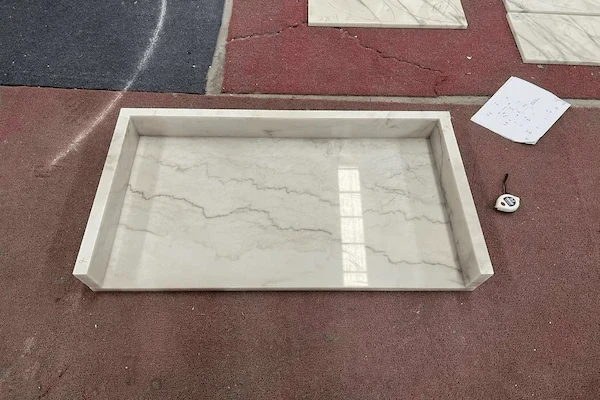 White Marble Vanity Top fabricated vanity component shown for cut-out and surface-detail review in a supplied factory image