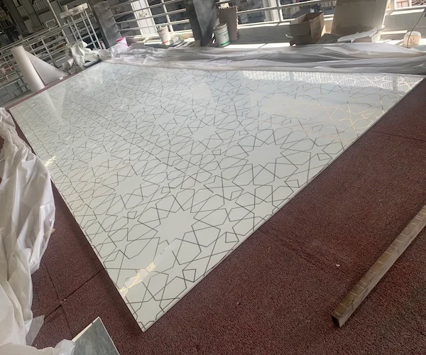 White Marble Waterjet Inlay with Brass Lines shown in a supplied brass-line alignment reference image